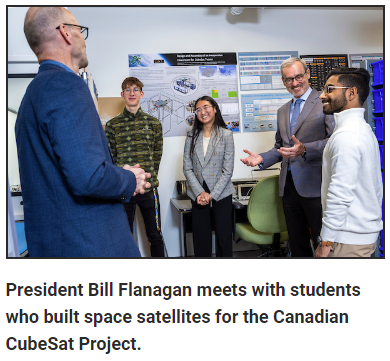 President Bill Flanagan speaking with four students.